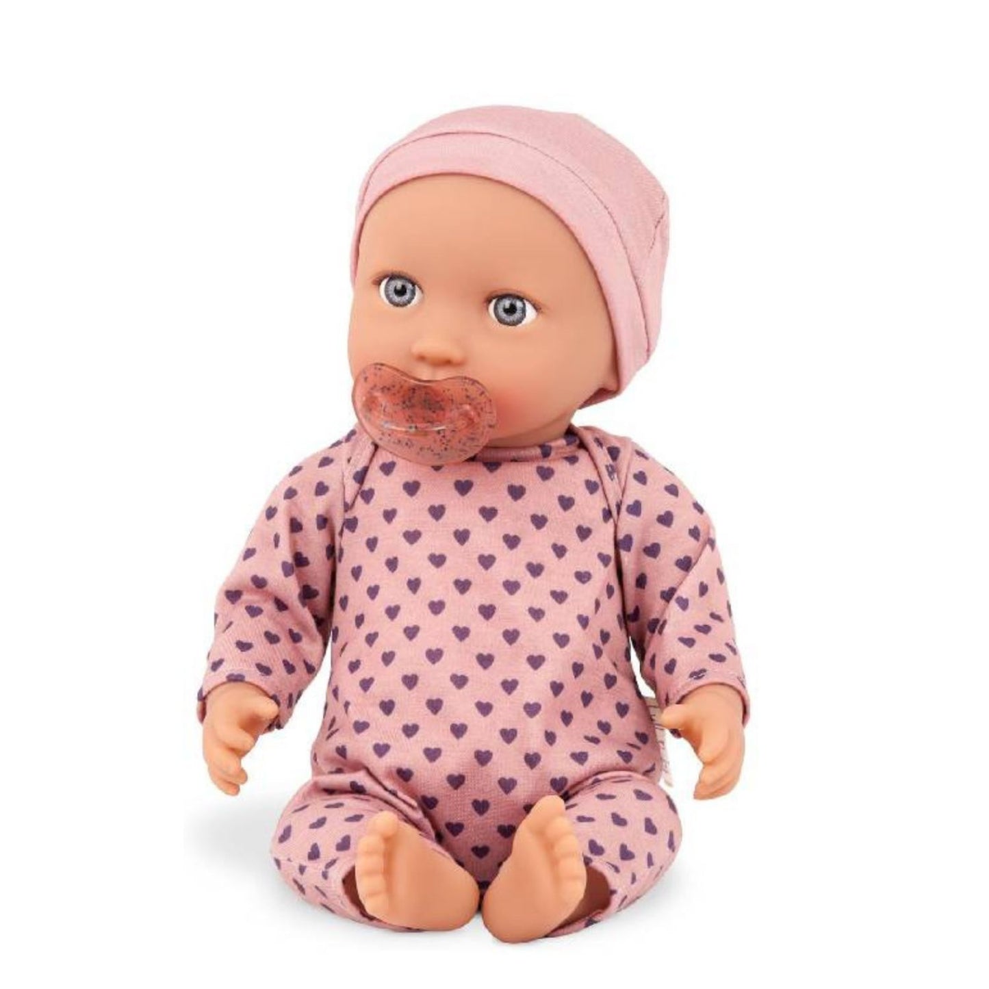 Muñeca con pijama rosa con corazones y gorro