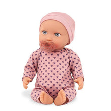 Muñeca con pijama rosa con corazones y gorro