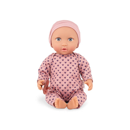 Muñeca con pijama rosa con corazones y gorro
